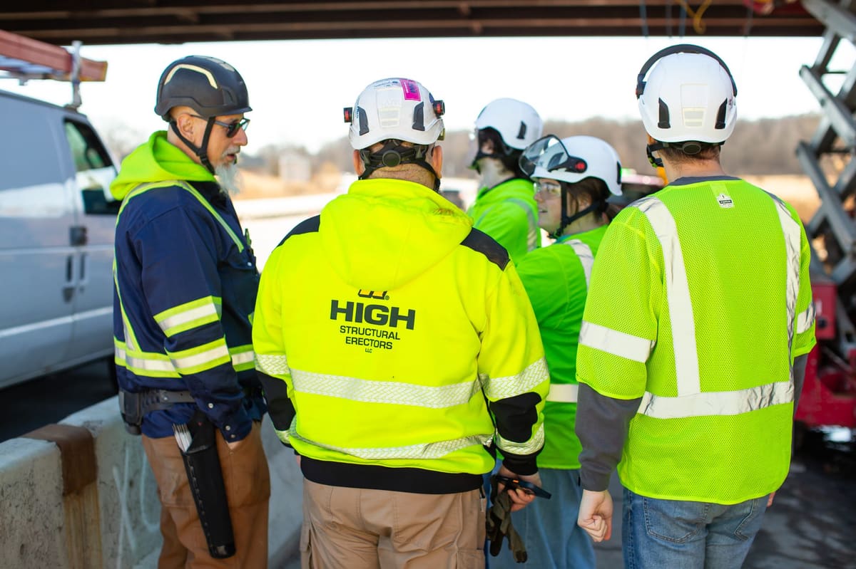 HSE crew in High Structural Erectors safety gear on a bridge deck