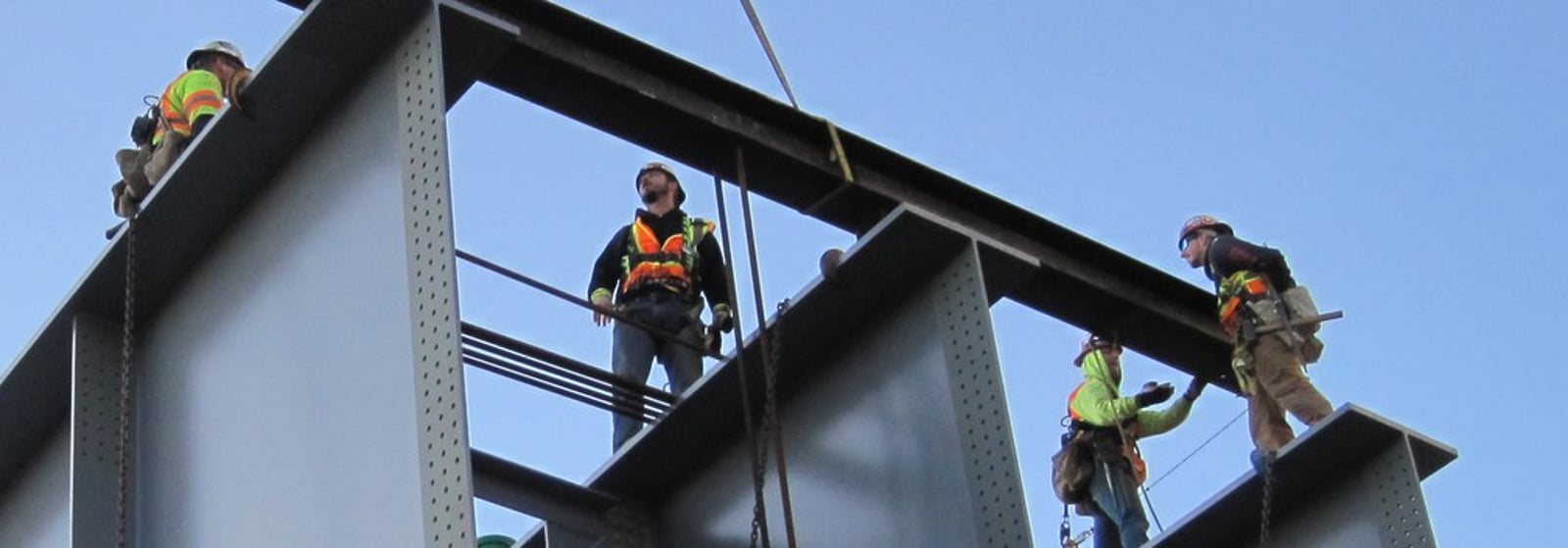 HSE ironworkers on a curved plate girder during a bridge steel pick