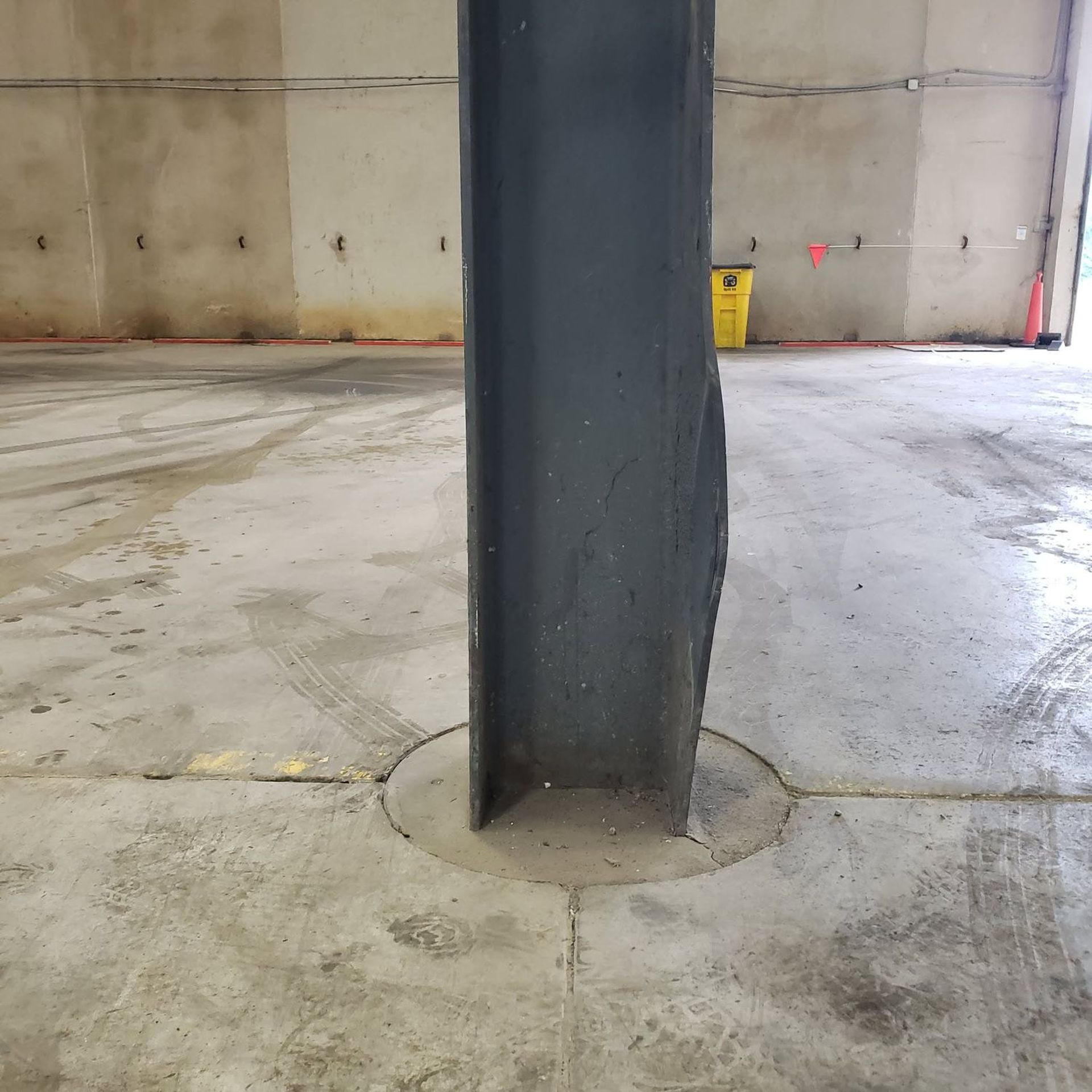 Impact-damaged steel column inside a facility