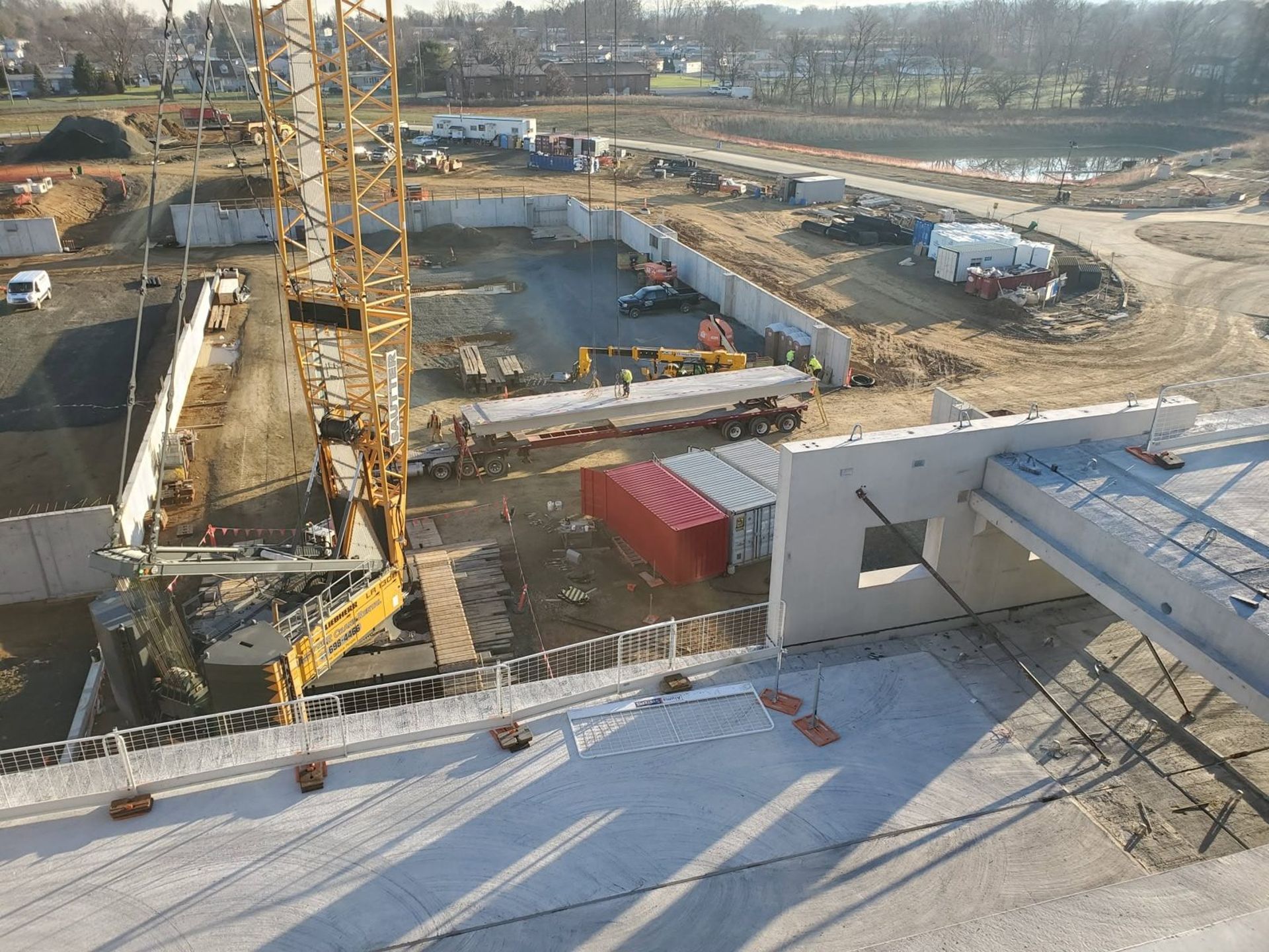 Double tee being placed on a garage deck