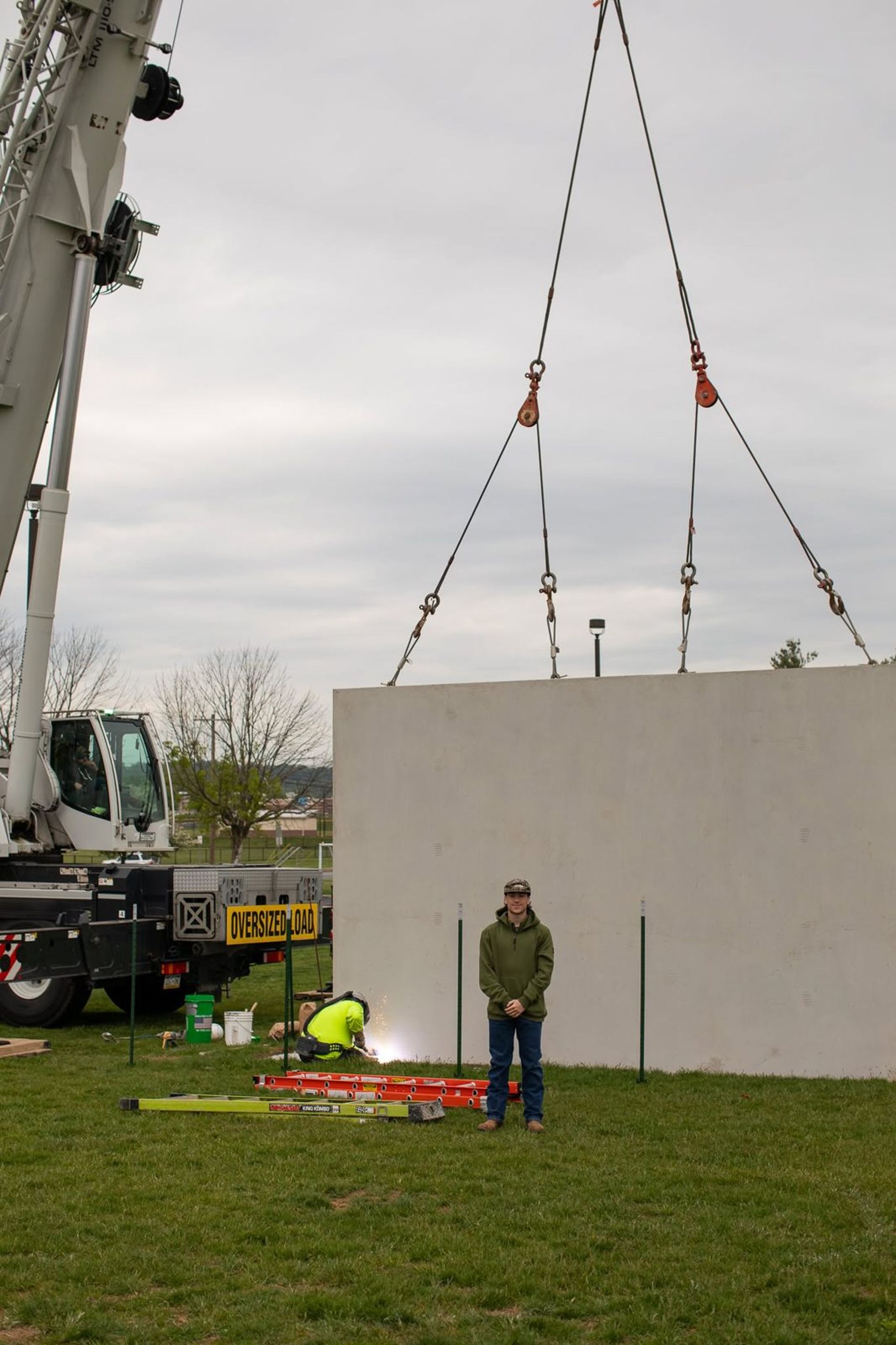 Precast wall panel being set