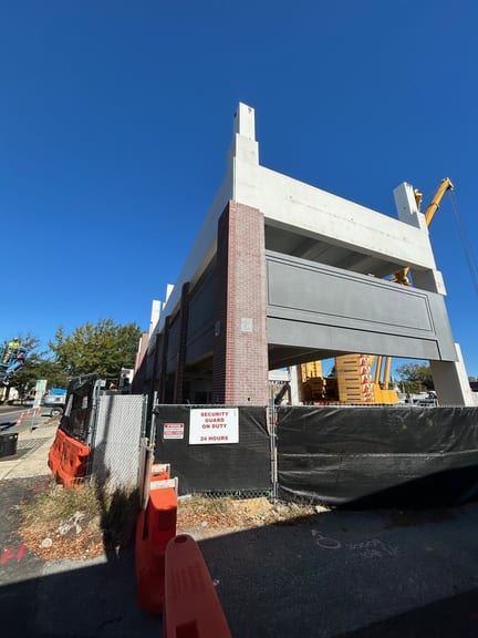 Corner of the Dover Mobility Parking Garage showing brick faced columns and precast spandrels
