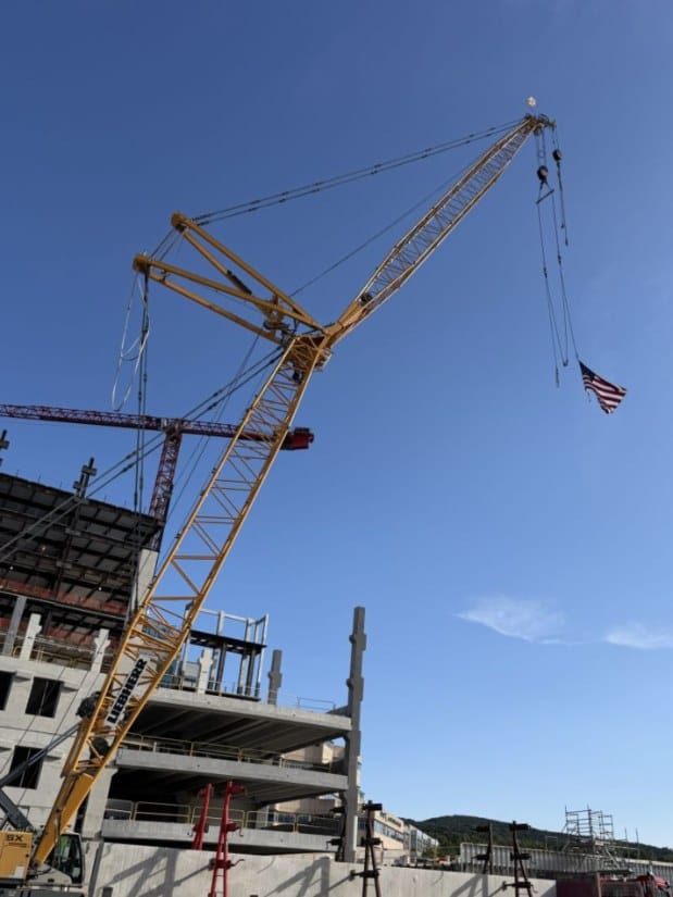 An American flag flying from the crane boom above the Geisinger garage on September 11