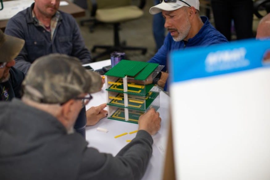 HSE ironworkers building a model structure during a team training exercise
